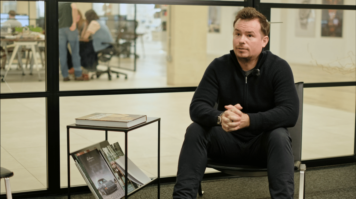 Jack Goodenday from LightField London sat in a chair whilst being interviewed.